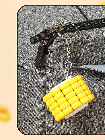 Juguete Sensorial Mini LLavero Maiz, con luz y granos desmotables. 5