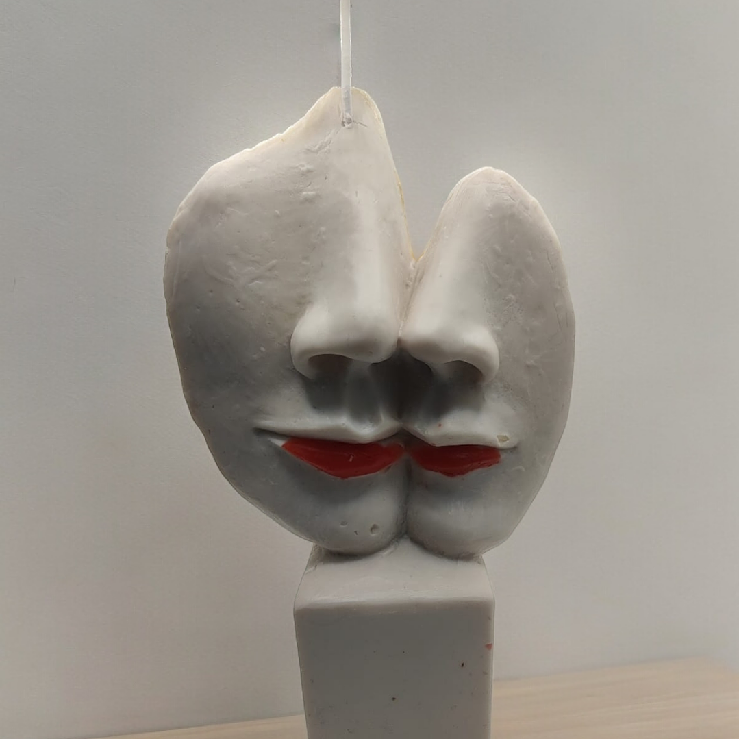 Vela estátua caras metades 2