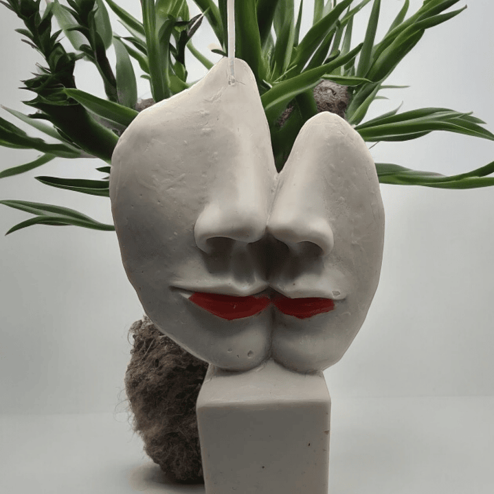 Vela estátua caras metades 1