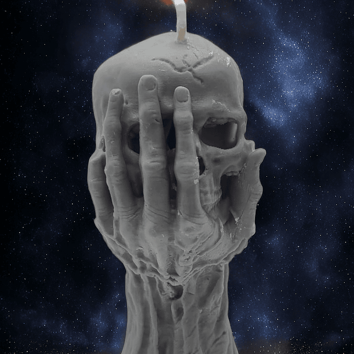 Vela mão a segurar caveira  1