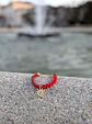 Pulsera de Cuero Trenzado Rojo con Dije de Sol en Rodio - Miniatura 2