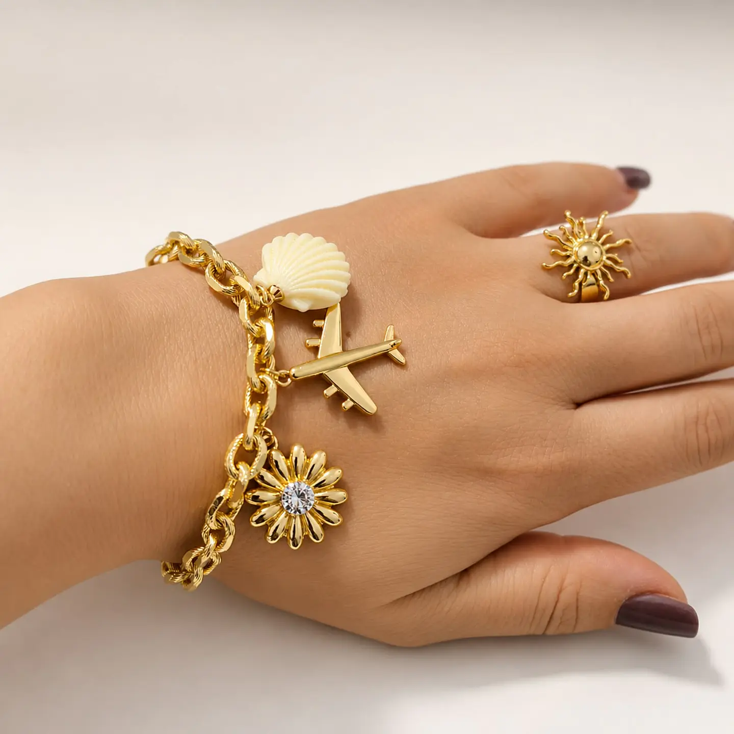 Pulsera en rodio con 3 dijes 1