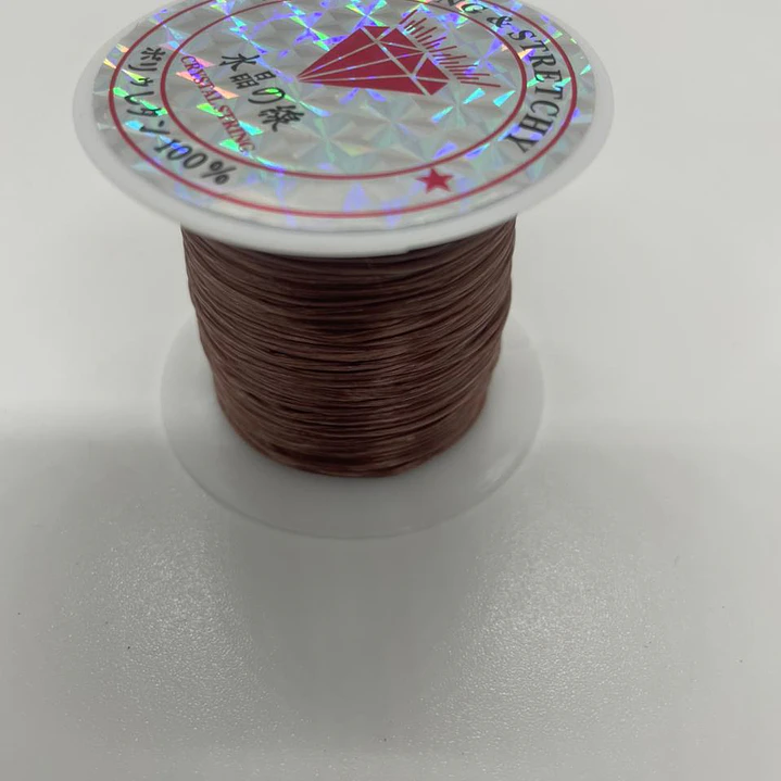 Hilo Elastico Para Pulsera 0.6 Mm Color Café Claro 20 Mtrs 13