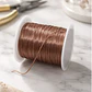 Hilo Elastico Para Pulsera 0.6 Mm Color Café Claro 20 Mtrs - Miniatura 1