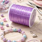 Hilo Elastico Para Pulsera 0.6 Mm Color Lila 20 Mtrs - Miniatura 1