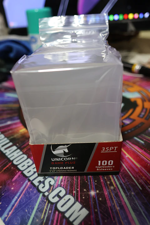 Top Loader Paquete con 25