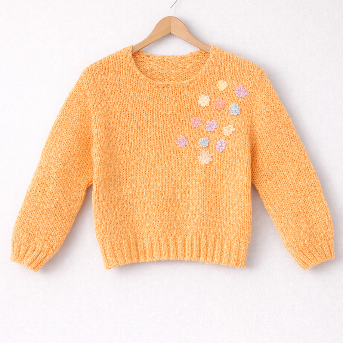 Suéter con flores en relieve pastel 7