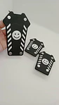 Set cubre pedales carita feliz, 3pzs - Negro/Blanco - Miniatura 1