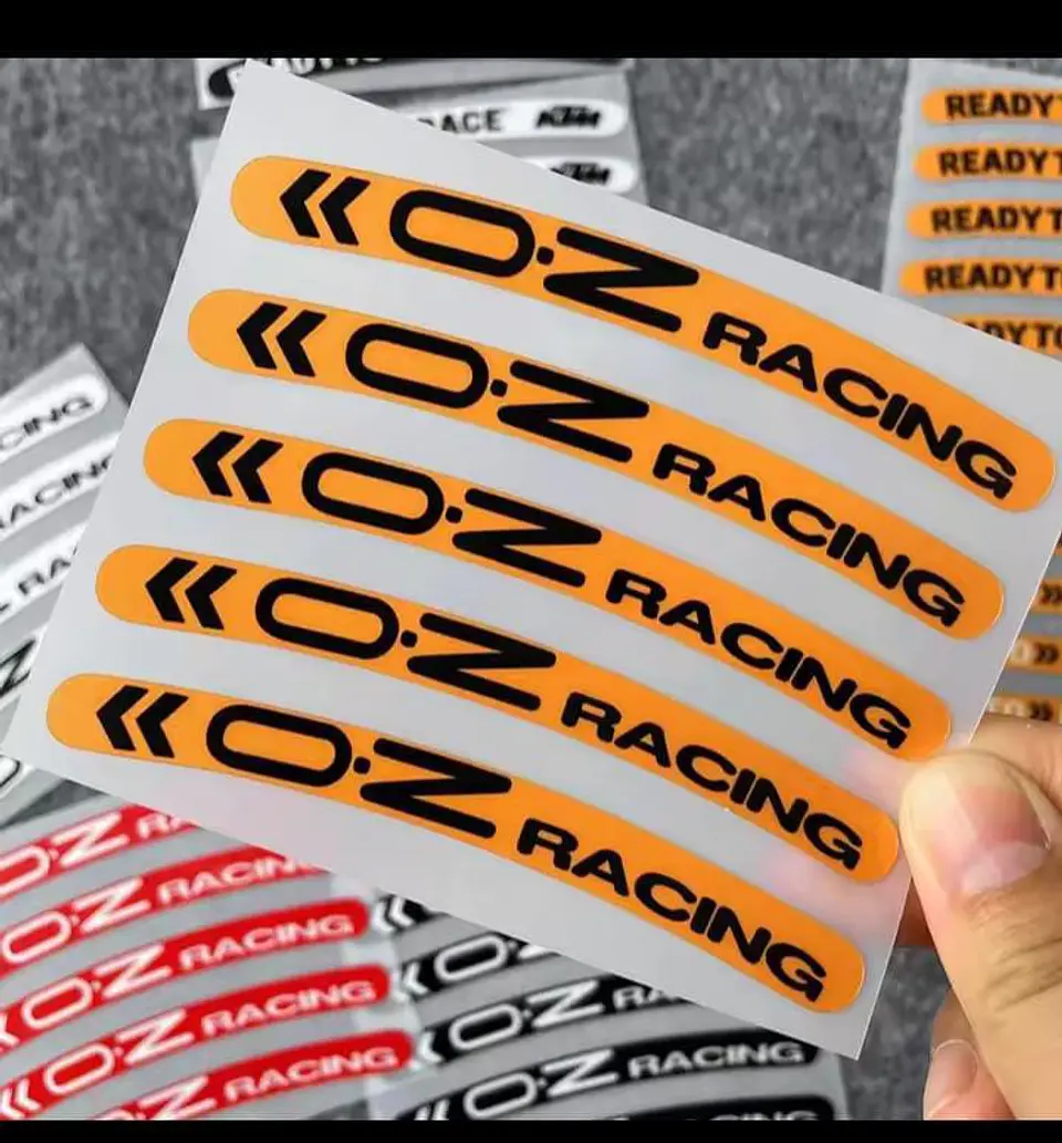Set X5 pegatinas reflectantes Oz Racing para llantas - Naranja/Negro 1