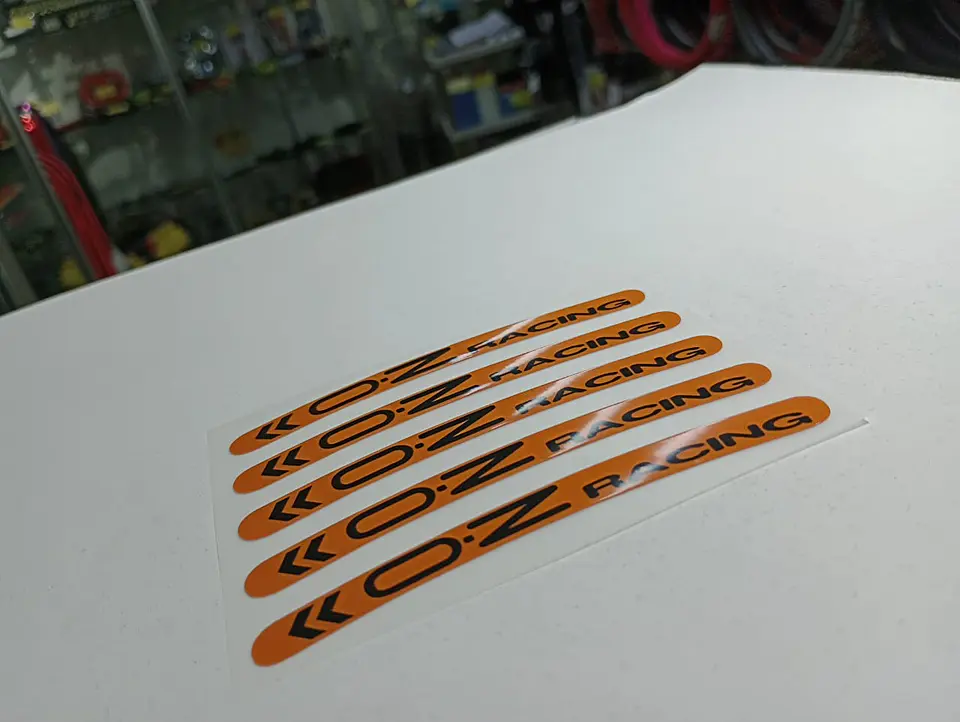 Set X5 pegatinas reflectantes Oz Racing para llantas - Naranja/Negro 10