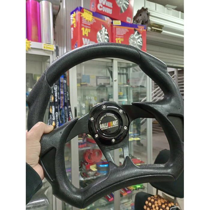 Volante de auto tipo D universal Tunning deportivo marca Rally art con botón de bocina medida 31cm diámetro externo centro negro 1