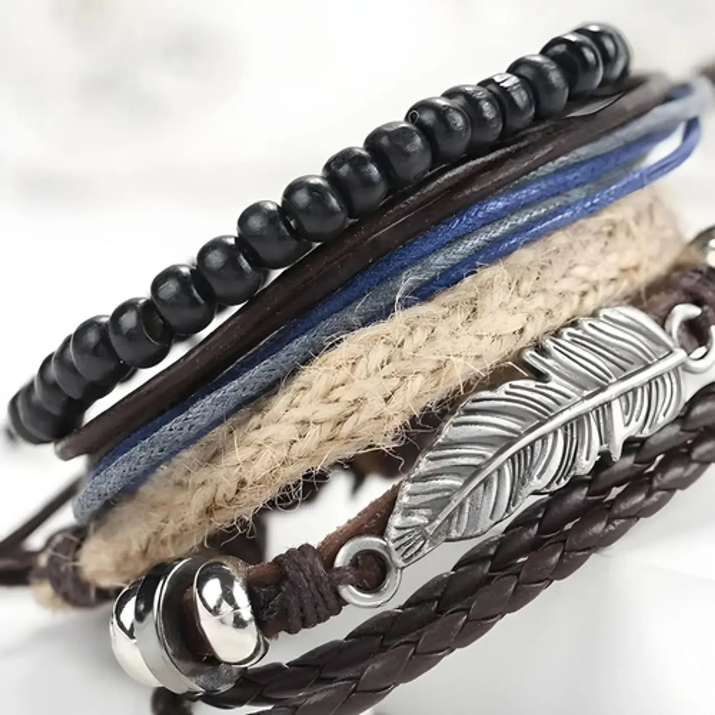Set 4 Pulseras para Hombre y mujer Manillas Cuero Pluma  9