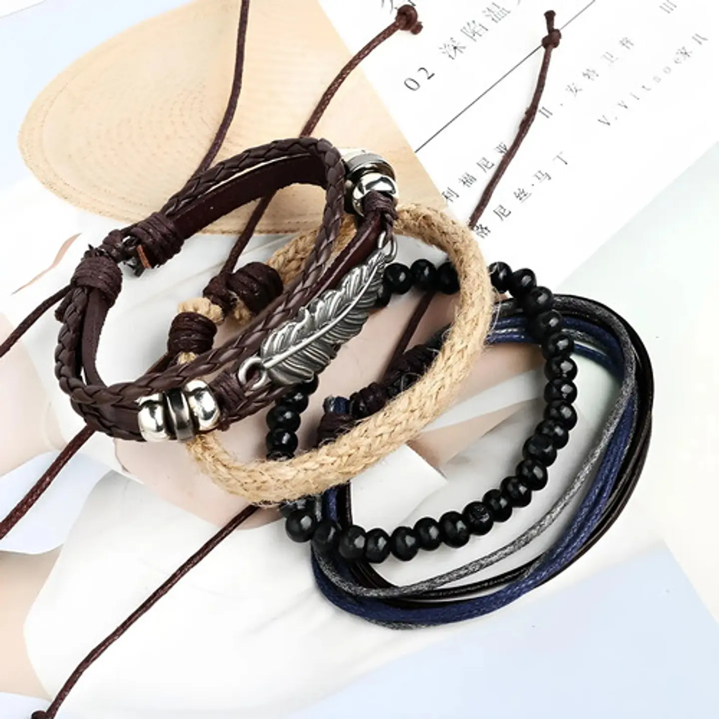 Set 4 Pulseras para Hombre y mujer Manillas Cuero Pluma  10