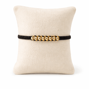 Manilla con balines en oro laminado