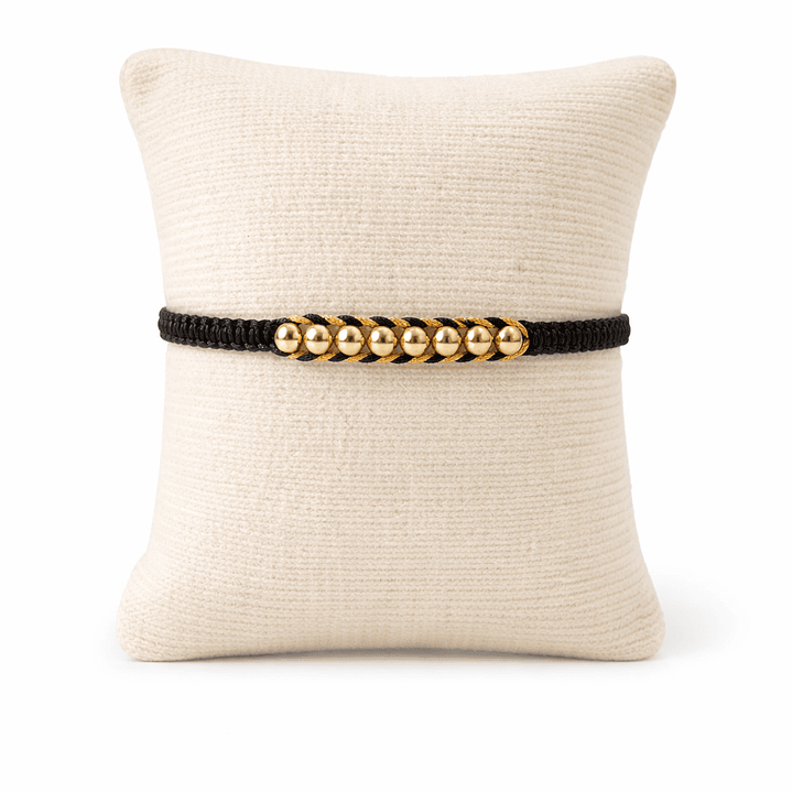 Manilla con balines en oro laminado 1