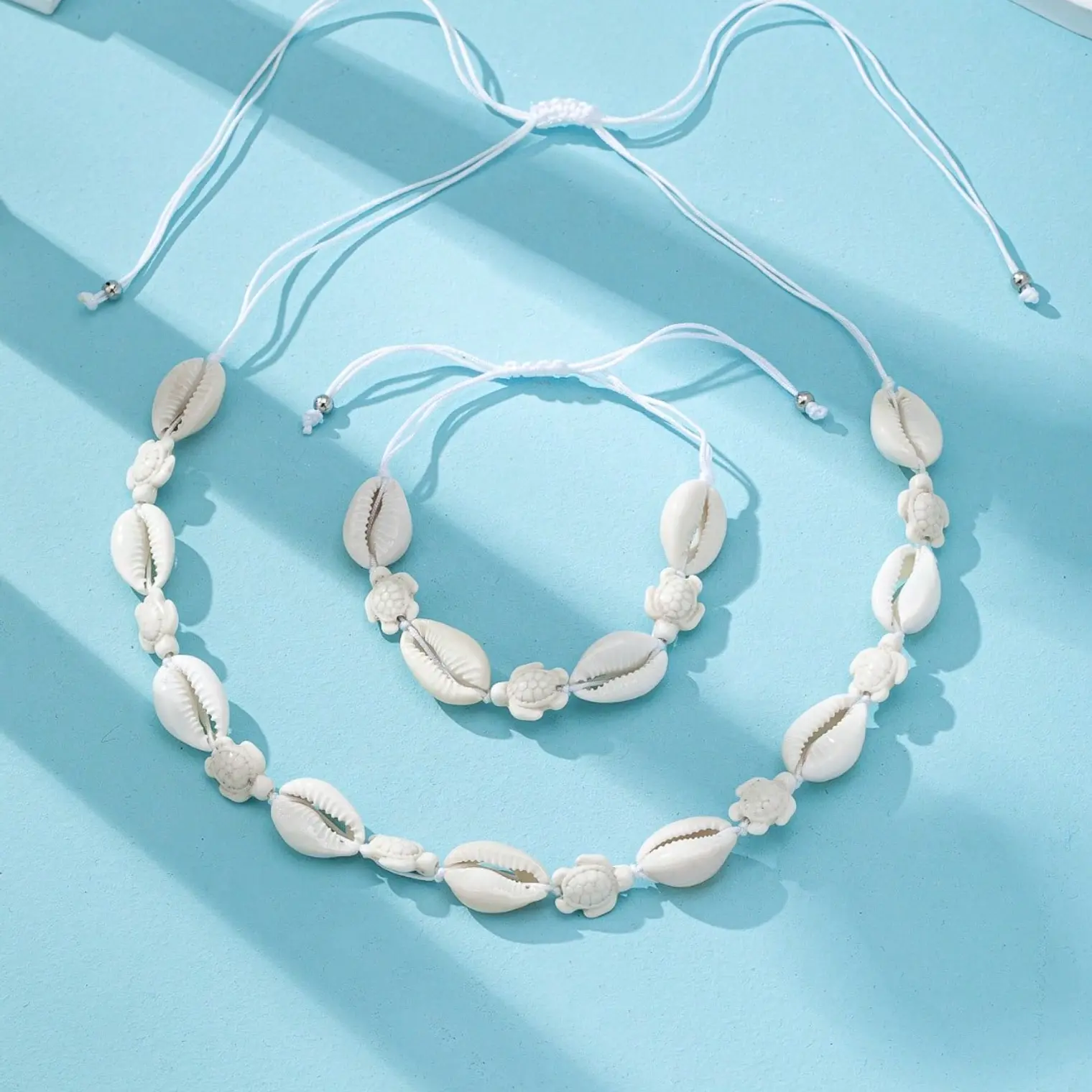 Conjunto colgante y pulsera pure y tortuga blanca 3