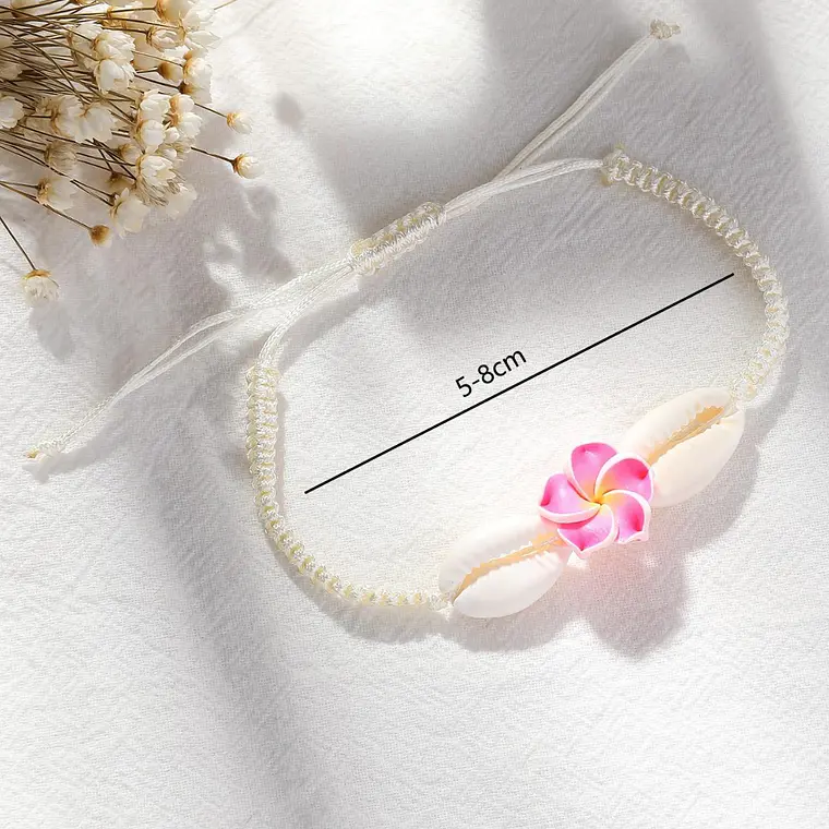 Pulsera de hilo con conchas pure blanco y tipanie fucsia 1