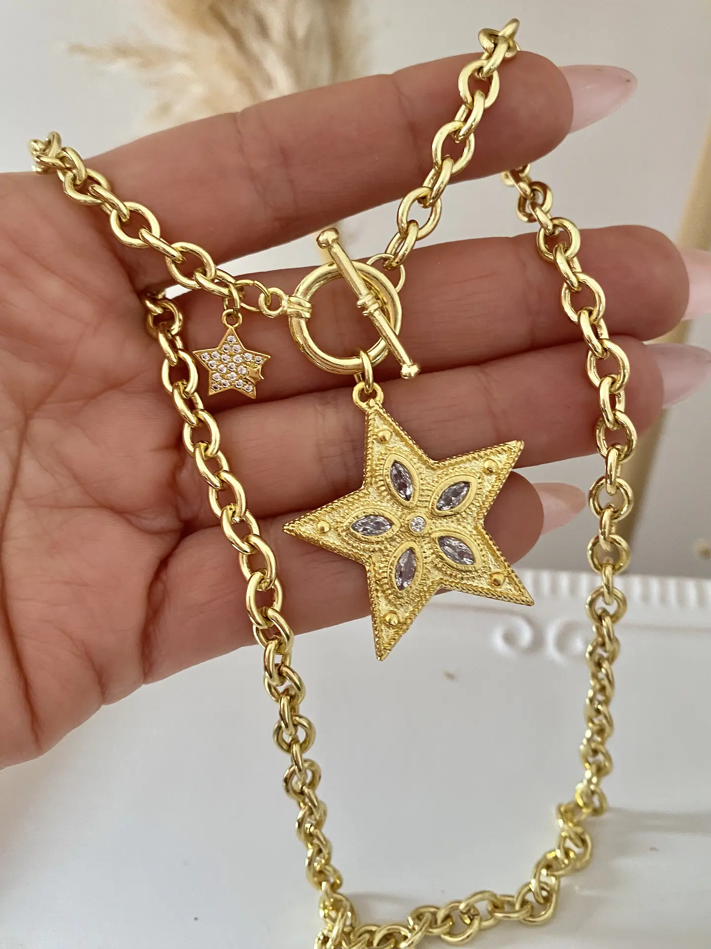 Collar Estrella Cristales Engastados y punto de luz lateral  1