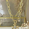 Collar Cruz con Maxi eslabones punto de luz gold