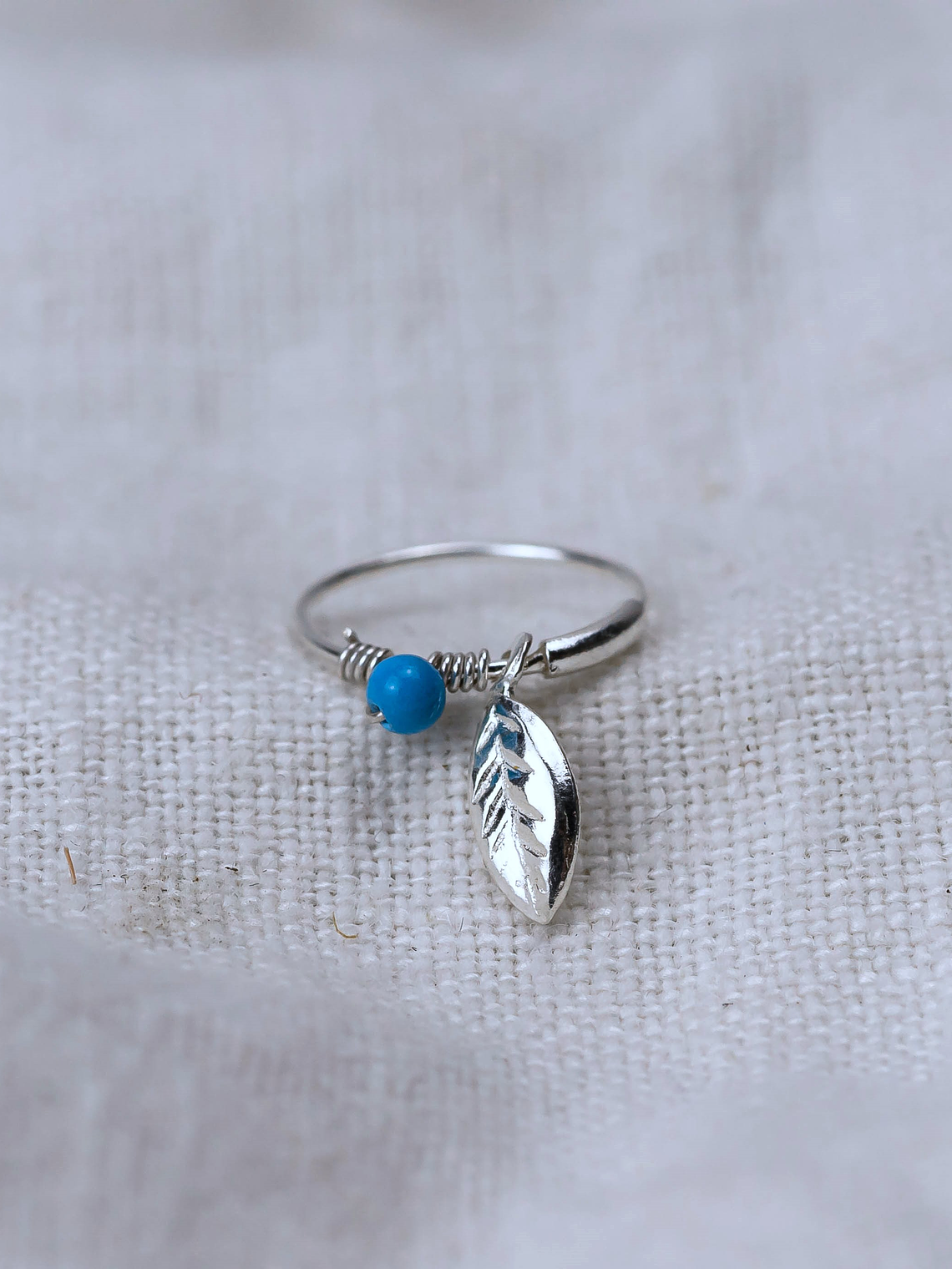 Piercing Solitario 10mm Pluma y Mostacilla Celeste 1