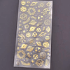 Lámina stickers fondo transparente PLANETAS doradas