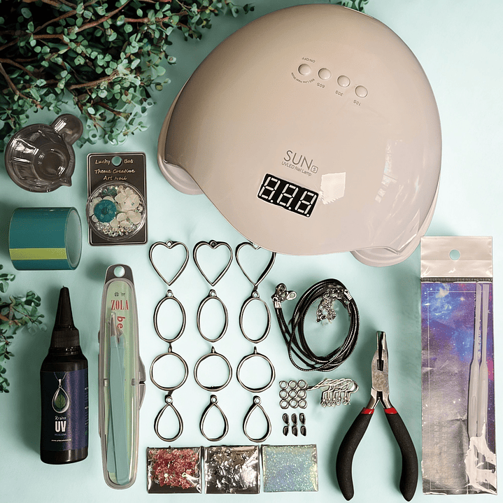 Kit inicial RESINA UV 50g con BISELES metálicos, flores, etc.. 1