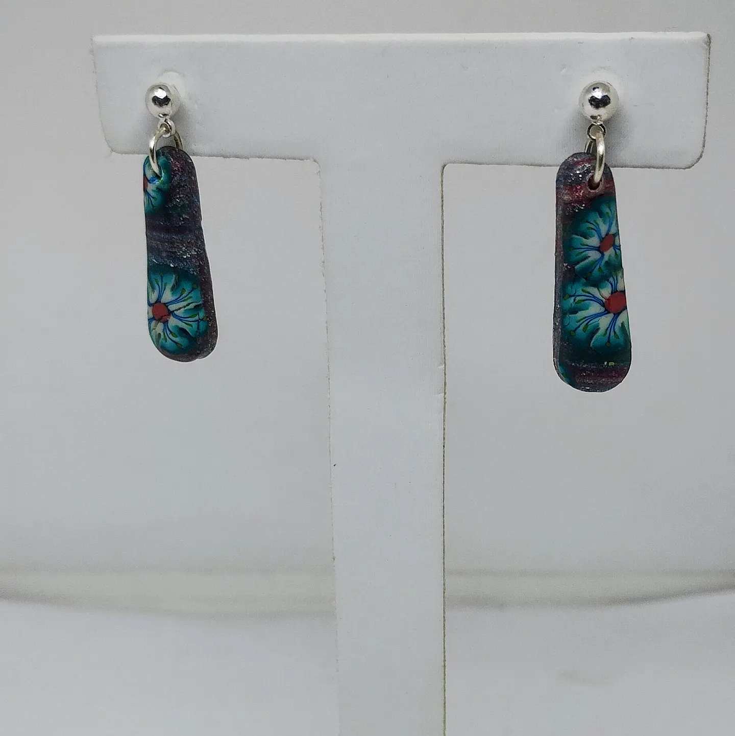 Pequeños aros alargados con flores 1