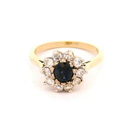 Anillo de Oro Amarillo 18K Flor con Zafiro Central y 10 Diamantes