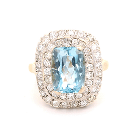 Anillo de Oro Amarillo y Blanco 18K Halo con Diamantes y Piedra Azul