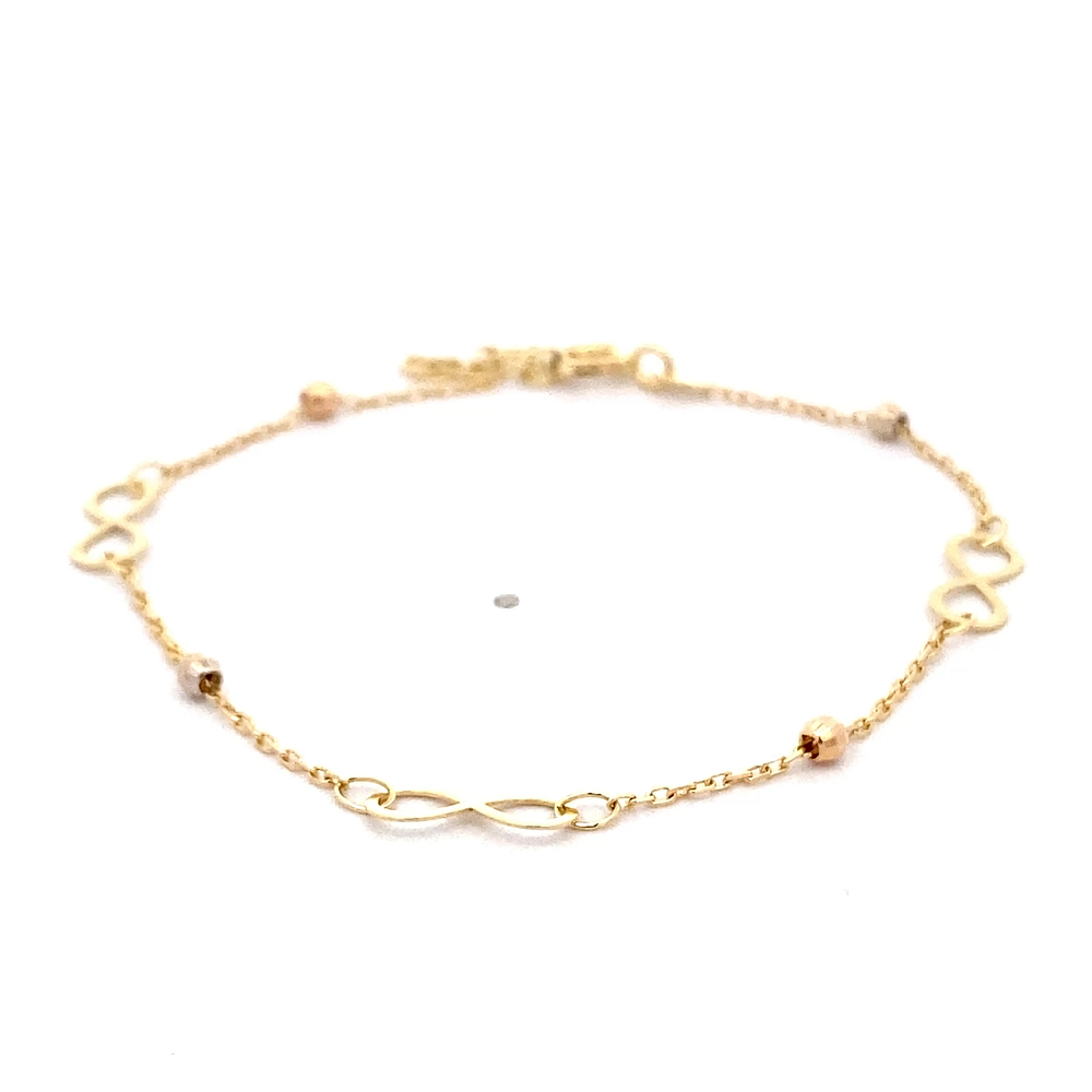 Pulsera de Oro Amarillo 18K Limada con 3 Dijes Infinitos y Esferas Diamantadas