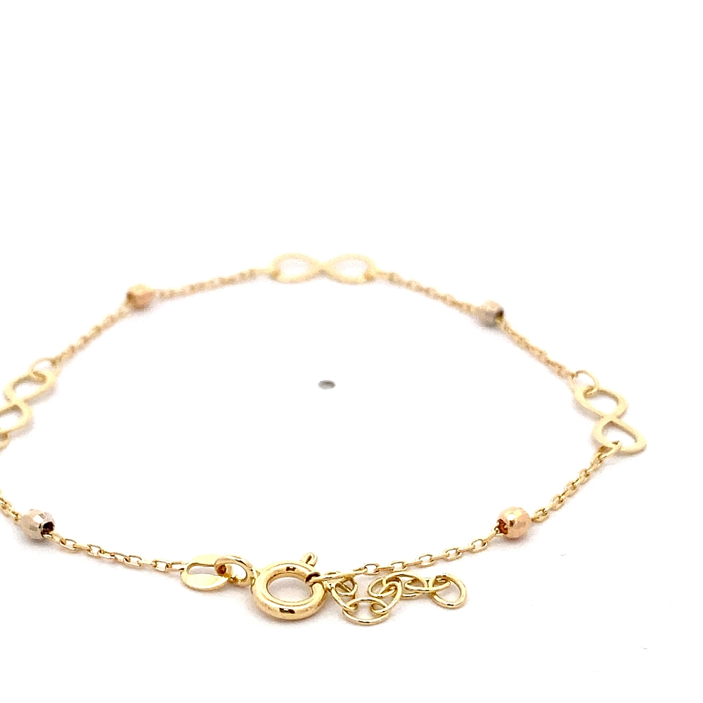 Pulsera de Oro Amarillo 18K Limada con 3 Dijes Infinitos y Esferas Diamantadas