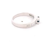 Anillo Cintillo 18K Rodinado con Diamantes y Zafiro Princess