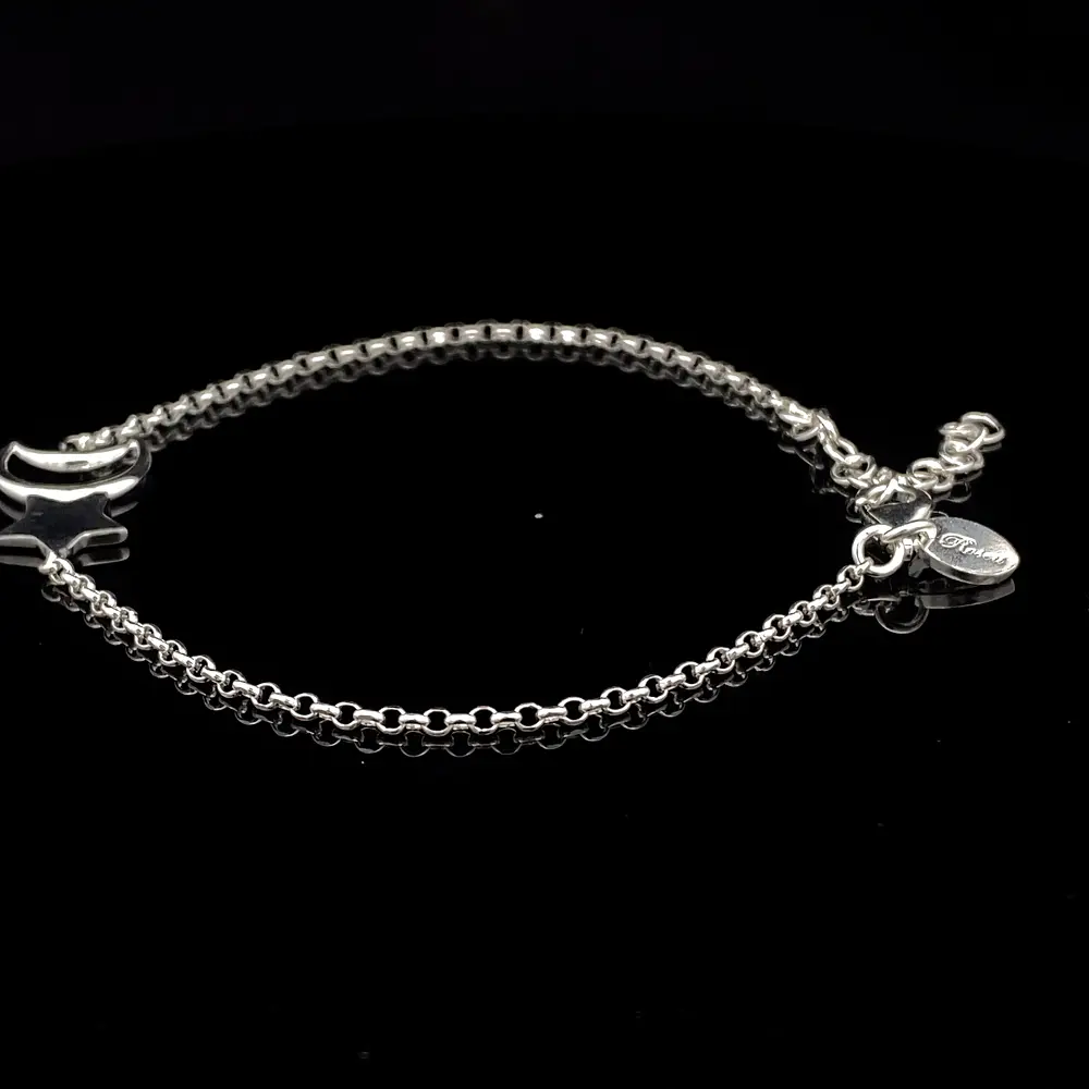 Pulsera de Plata Rolo con Estrella Lisa y Luna Troquelada