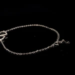 Tobillera de Plata con Dos Corazones y Piedras Incoloras Incrustadas