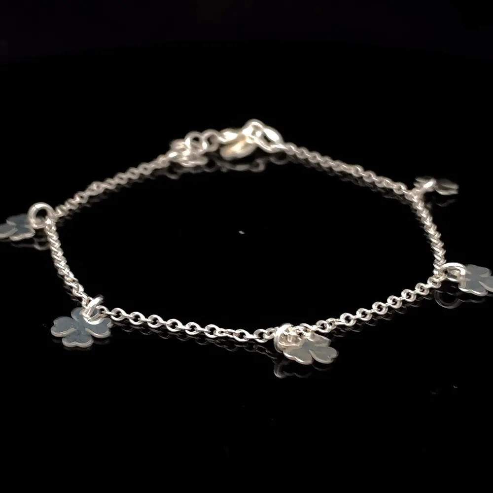 Pulsera de Plata Rolo con Tréboles Intercalados