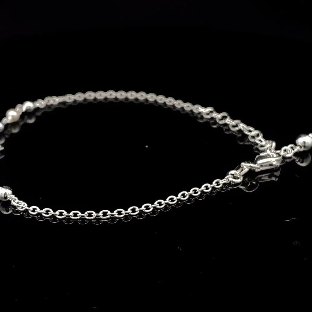 Pulsera de Plata Limada con Corazón Central y Esferas Continuas