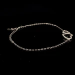 Tobillera de Plata con Dos Corazones y Piedras Incoloras Incrustadas