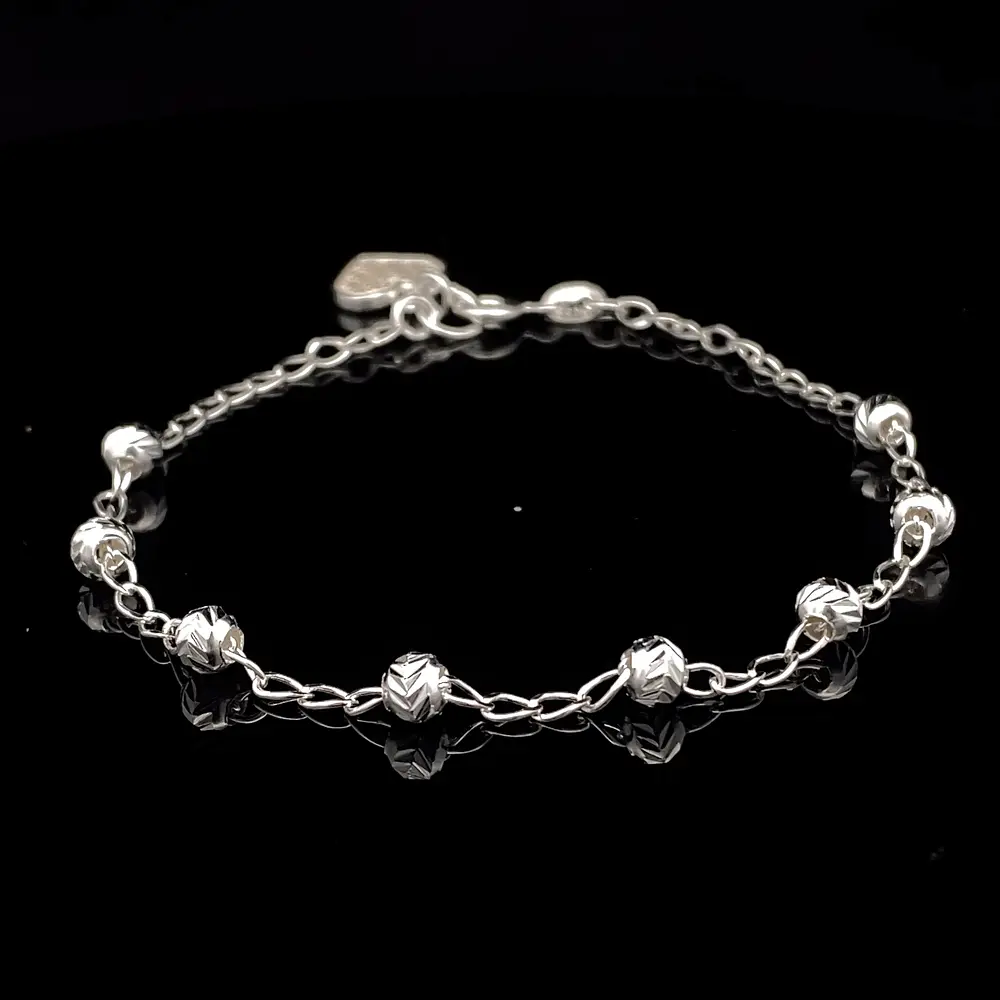 Pulsera de Plata Bilbao con Esferas Talladas y Corazón Final