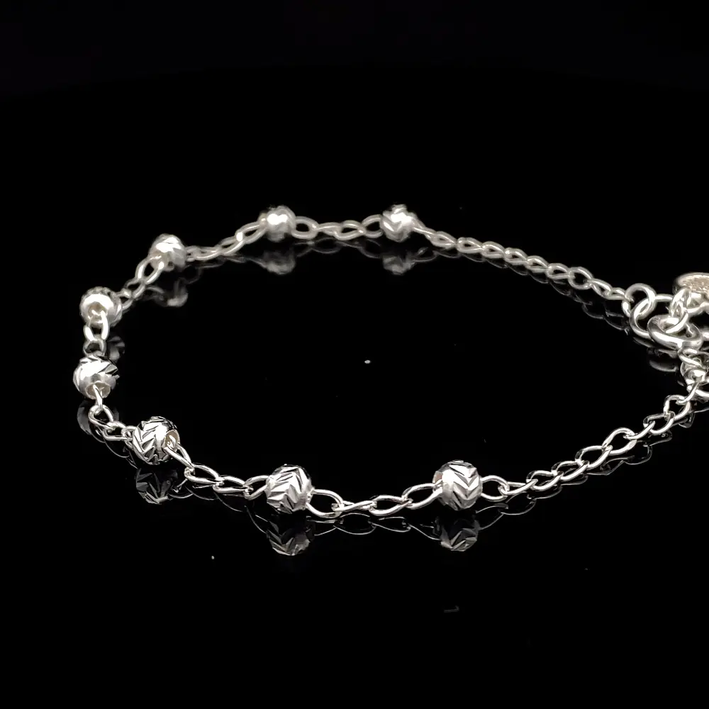 Pulsera de Plata Bilbao con Esferas Talladas y Corazón Final