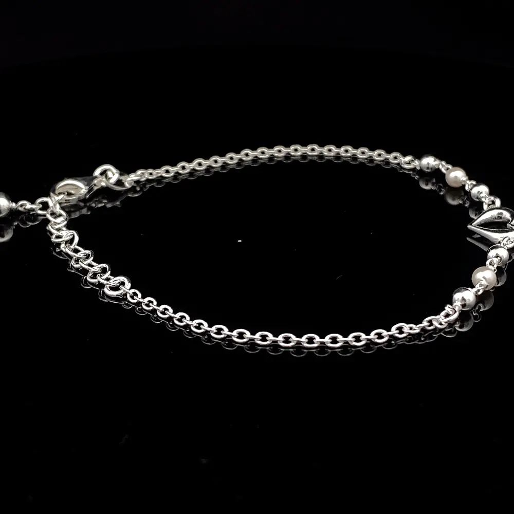 Pulsera de Plata Limada con Corazón Central y Esferas Continuas