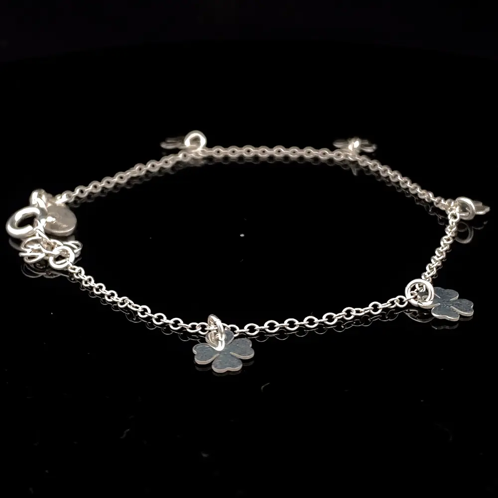 Pulsera de Plata Rolo con Tréboles Intercalados