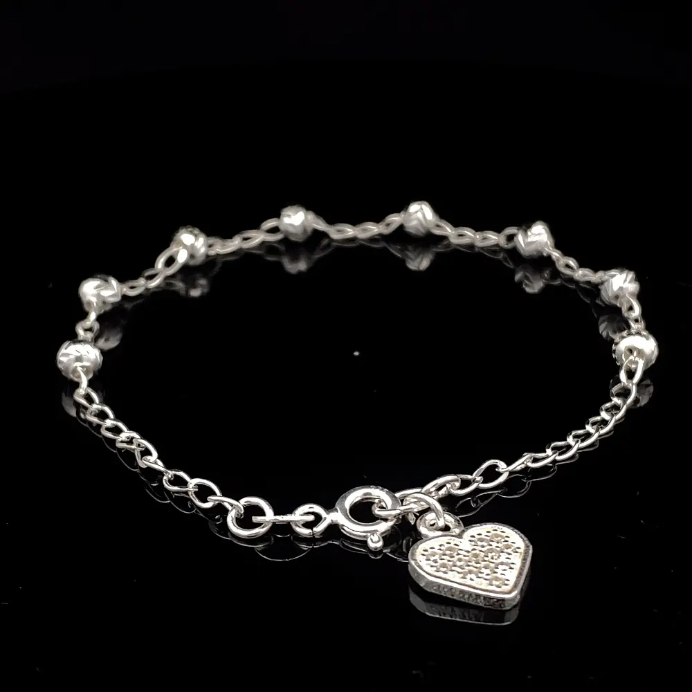 Pulsera de Plata Bilbao con Esferas Talladas y Corazón Final