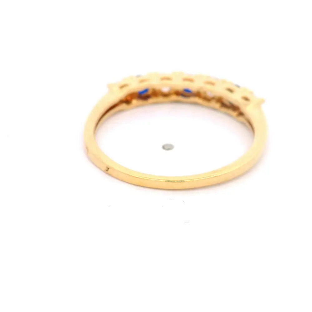 Anillo de Oro Amarillo 18K Cintillo con 4 MCP Incoloras y 3 MCP Azules