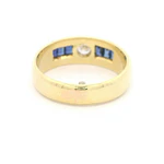 Anillo Bombé de Oro Amarillo 18K con 6 Piedras Azules y Diamante
