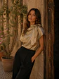 Blusa Metalizada Dorada con Lazo Mujer - Miniatura 1