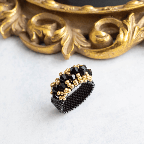 Anillo "Corona" negro y dorado