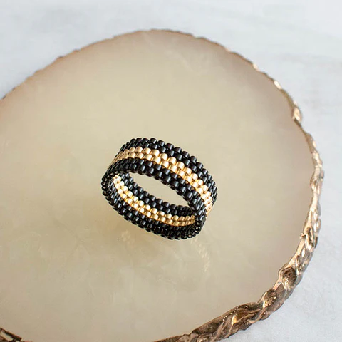 Anillo "Cintas" negro y dorado