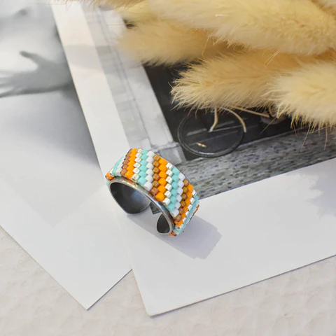 Anillo ajustable "Líneas diagonal" naranjo, café y turquesa