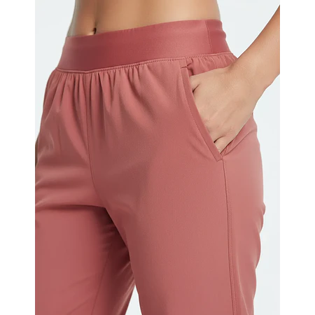 Pantalón Jogger Mujer Under Armour Rival UA Storm Woven Tiro Alto 1383315-688 – Protección Ligera para Uso Diario Real