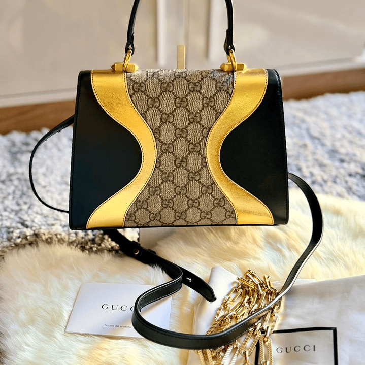 CARTERA DORADA GUCCI 4